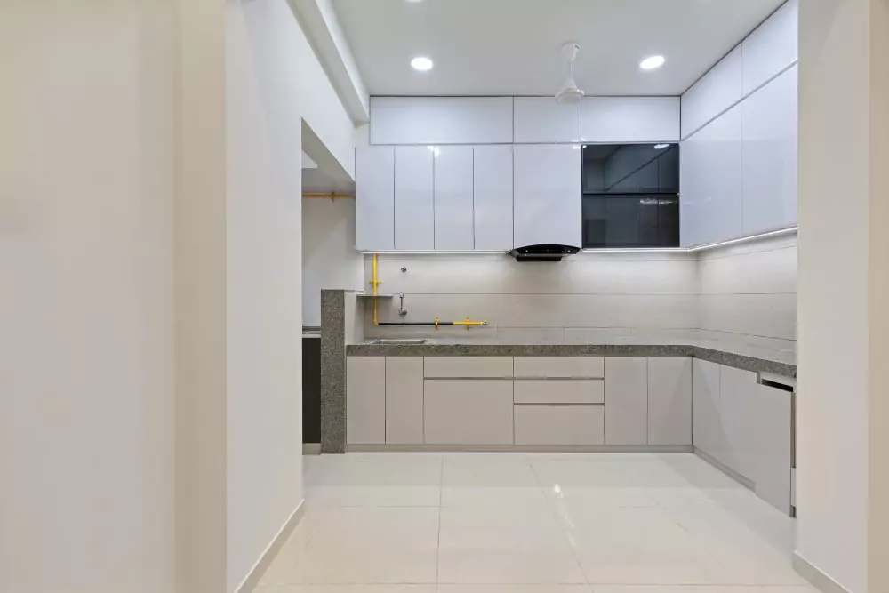 Modular kitchen with white Cabinets